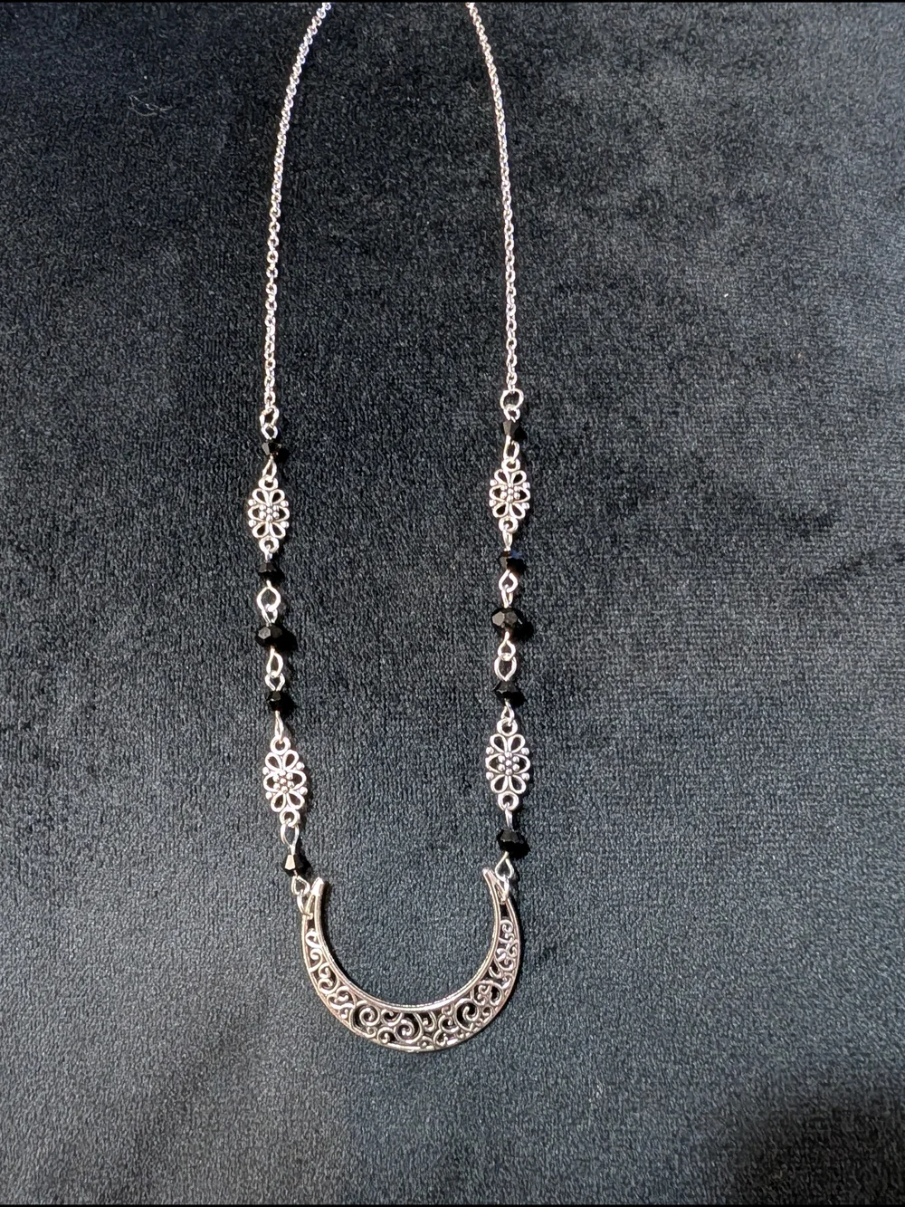 Silver Tone Filigree Crescent Pendant Necklace with Black Accents